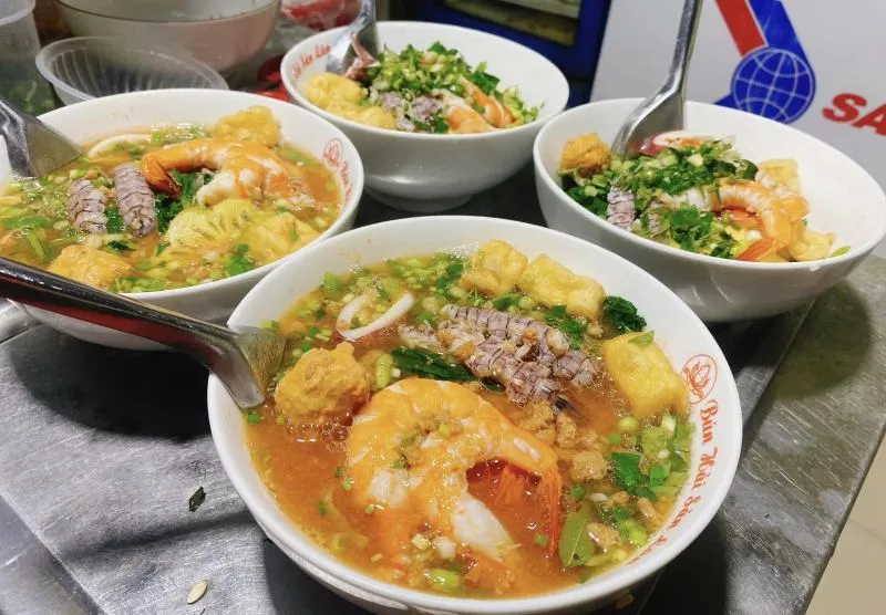 A flavorful bowl of Hanoi style seafood noodles from a neighborhood eatery street food night market hanoi