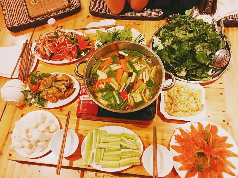 Warm salmon hotpot in cold Sapa what to eat in sapa