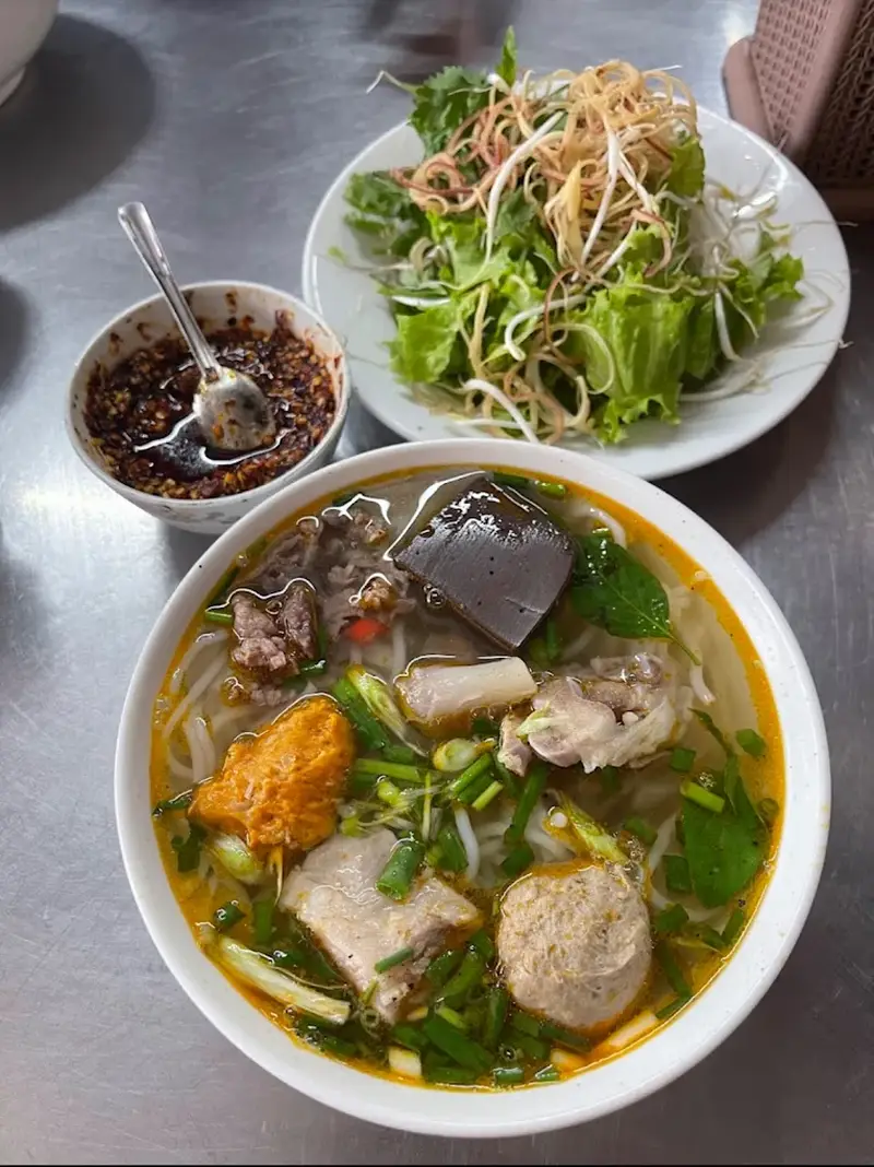 Authentic bun bo Hue with rich spicy broth best places to eat in hue